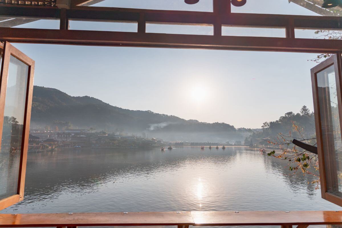 Traditional wooden house with a serene lake and Doi Luang mountain view in Chiang Dao