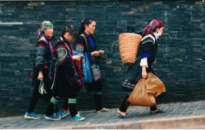Hill tribe villagers walking along a mountain path in northern Thailand.