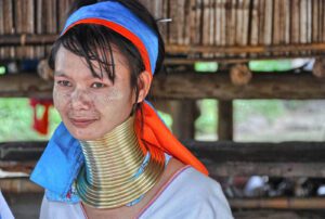 Karen long-neck hill tribe woman wearing traditional brass rings.
