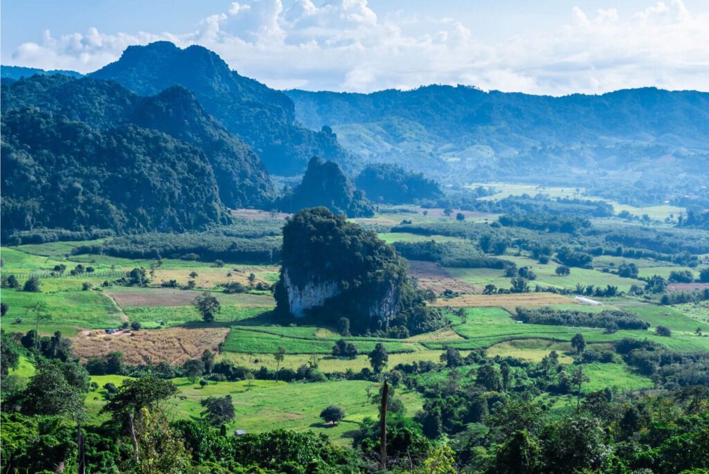 off-path-thailand-nan-valley Misty valley surrounded by rolling mountains in Nan province, northern Thailand.