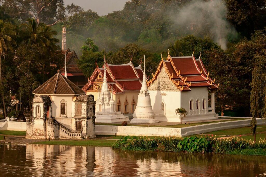 Uthai Thani riverfront and temple area view from the opposite bank showing local life along the water
