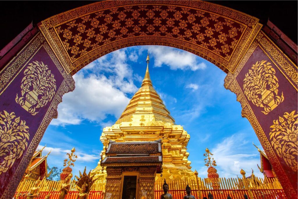 Doi Suthep golden stupa at sunrise overlooking Chiang Mai.