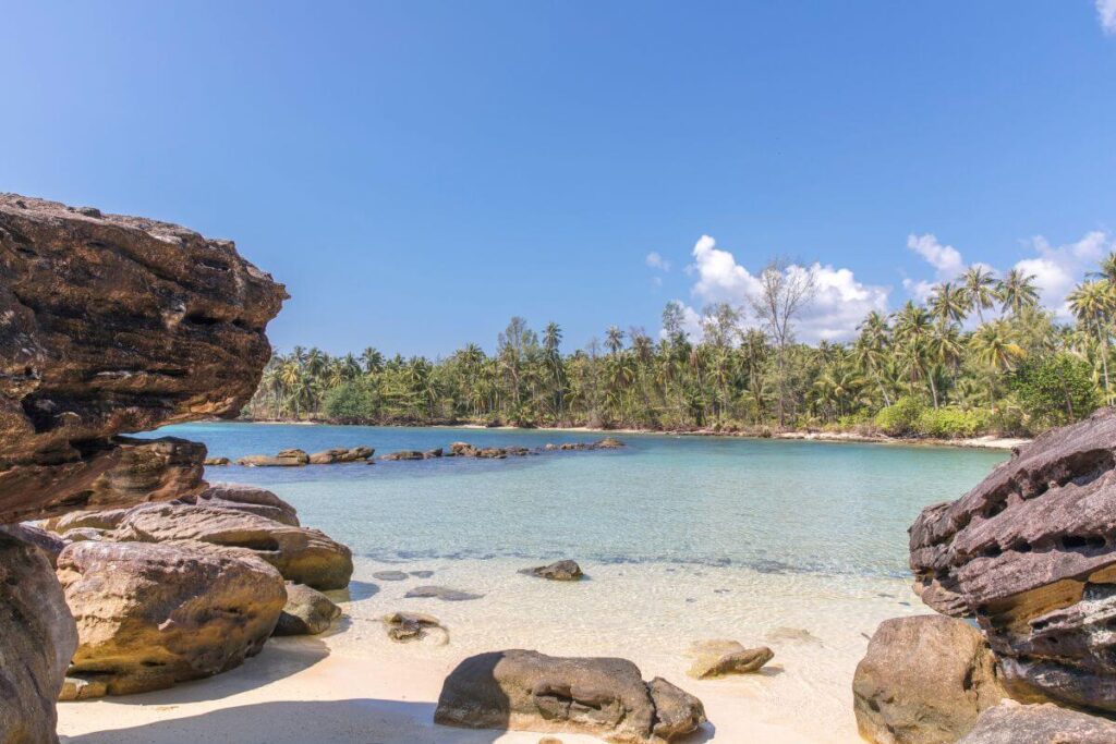 calm white-sand beach on Koh Kood with clear shallow water