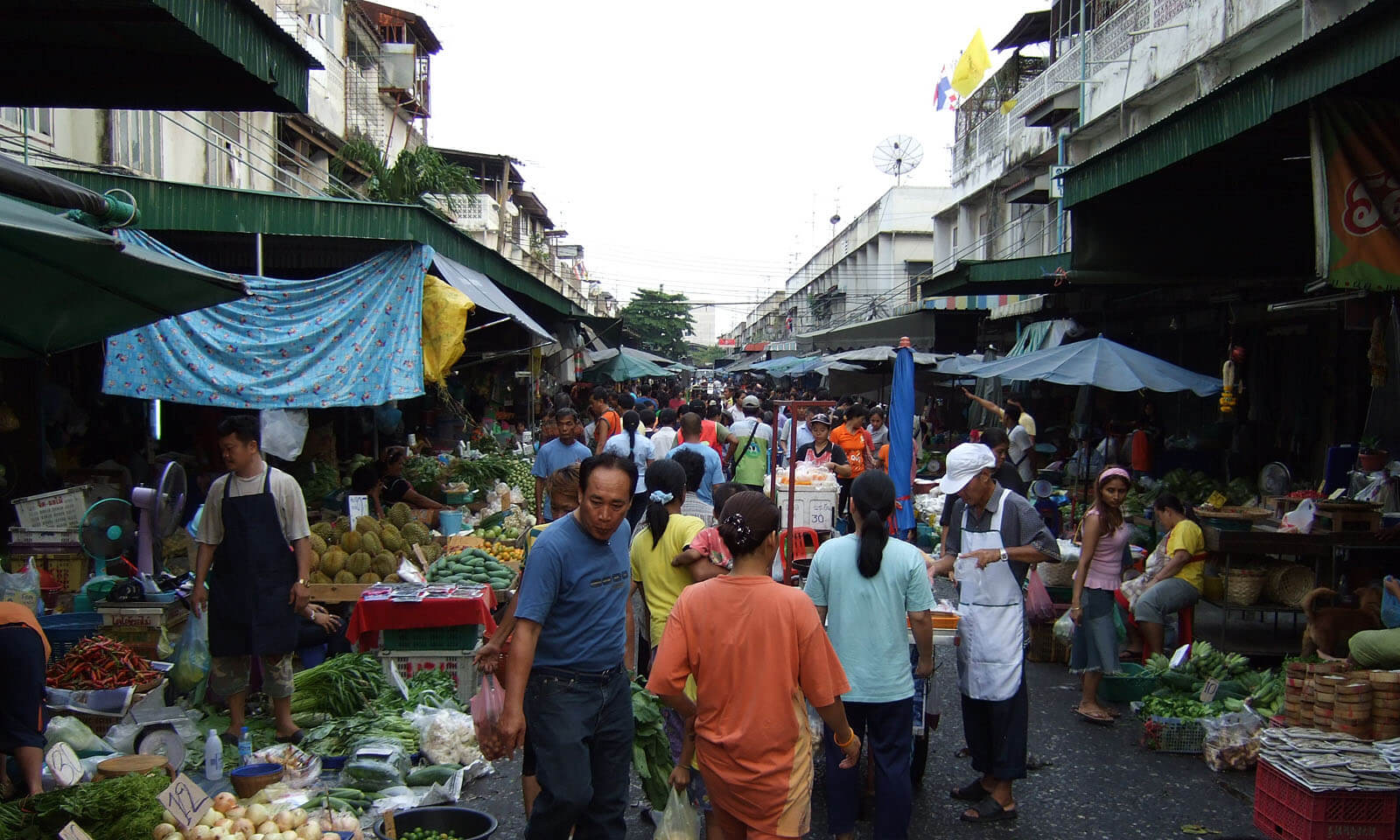 Khlong Toei Fresh Market in Bangkok with produce and vendors