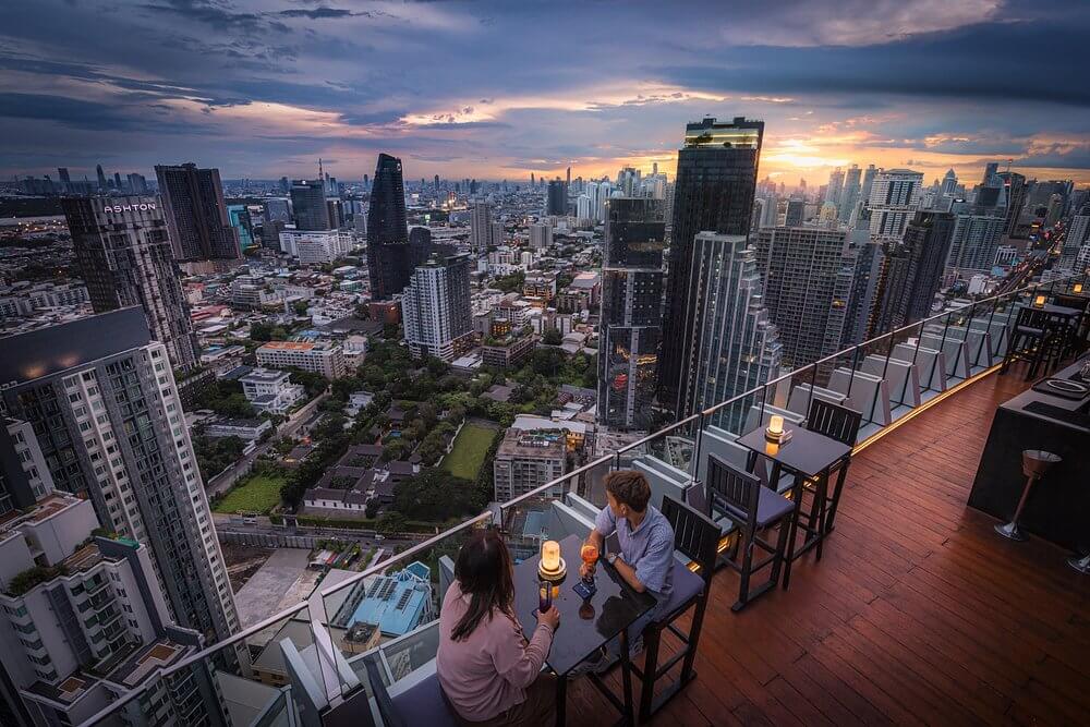 Panoramic Bangkok skyline from Octave rooftop lounge in Thonglor during golden hour in 2026