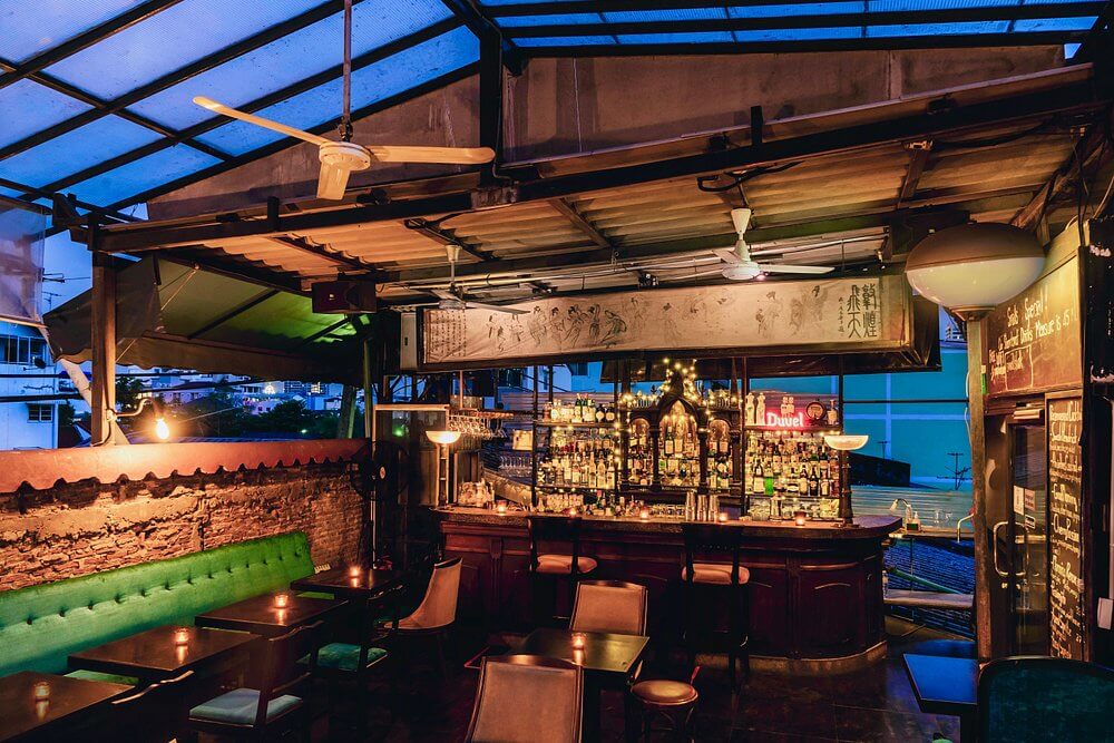 Rooftop area at Smalls Jazz Club in Bangkok with warm lighting and an intimate atmosphere above the city