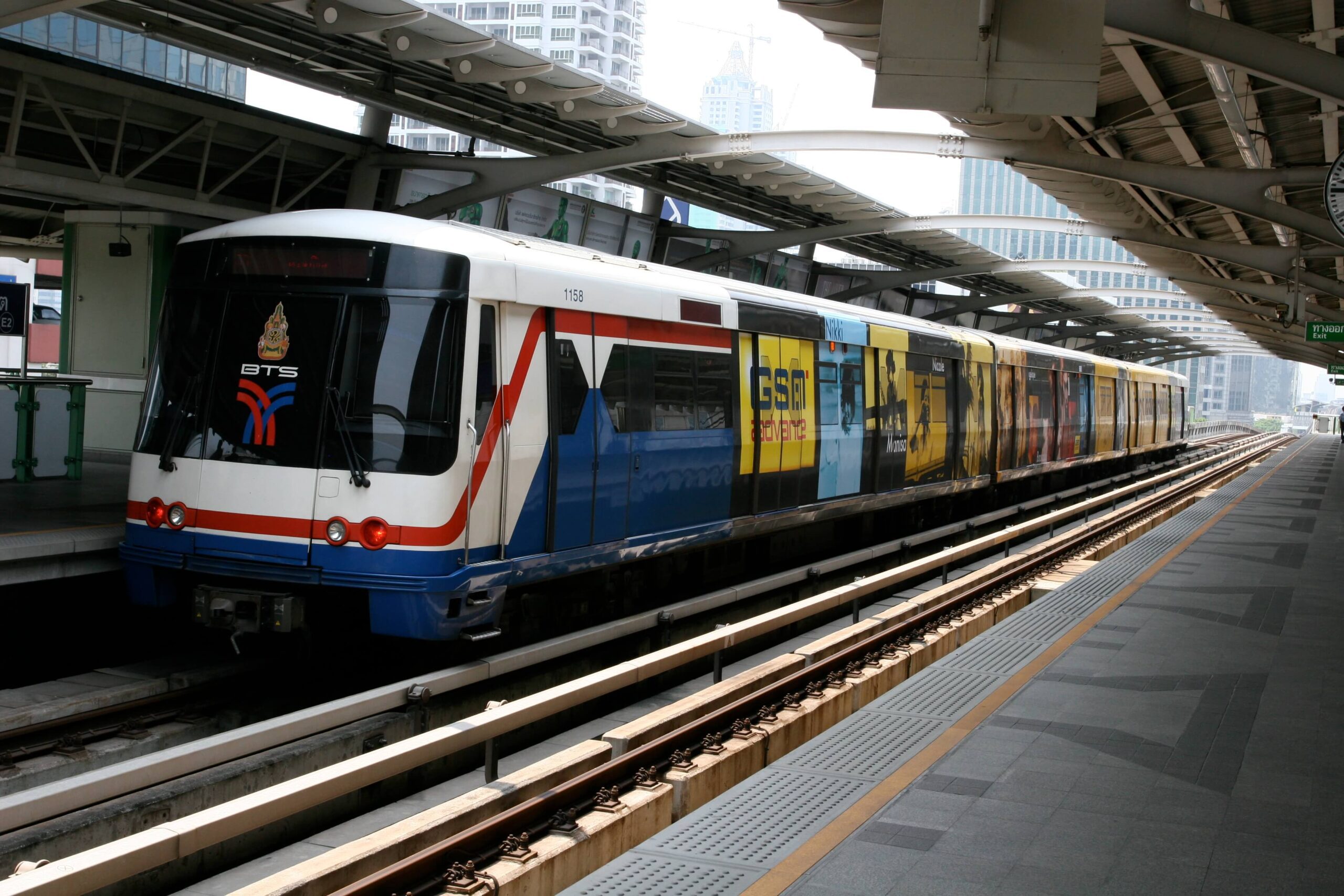 Bangkok BTS Skytrain platform showing trains and commuters, a fast way to avoid traffic in 2026