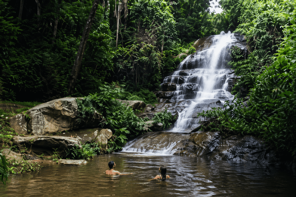 A lush view of Huay Kaew Waterfall in full flow, a key highlight of our Chiang Mai rainy season guide for Off Path Thailand travel.