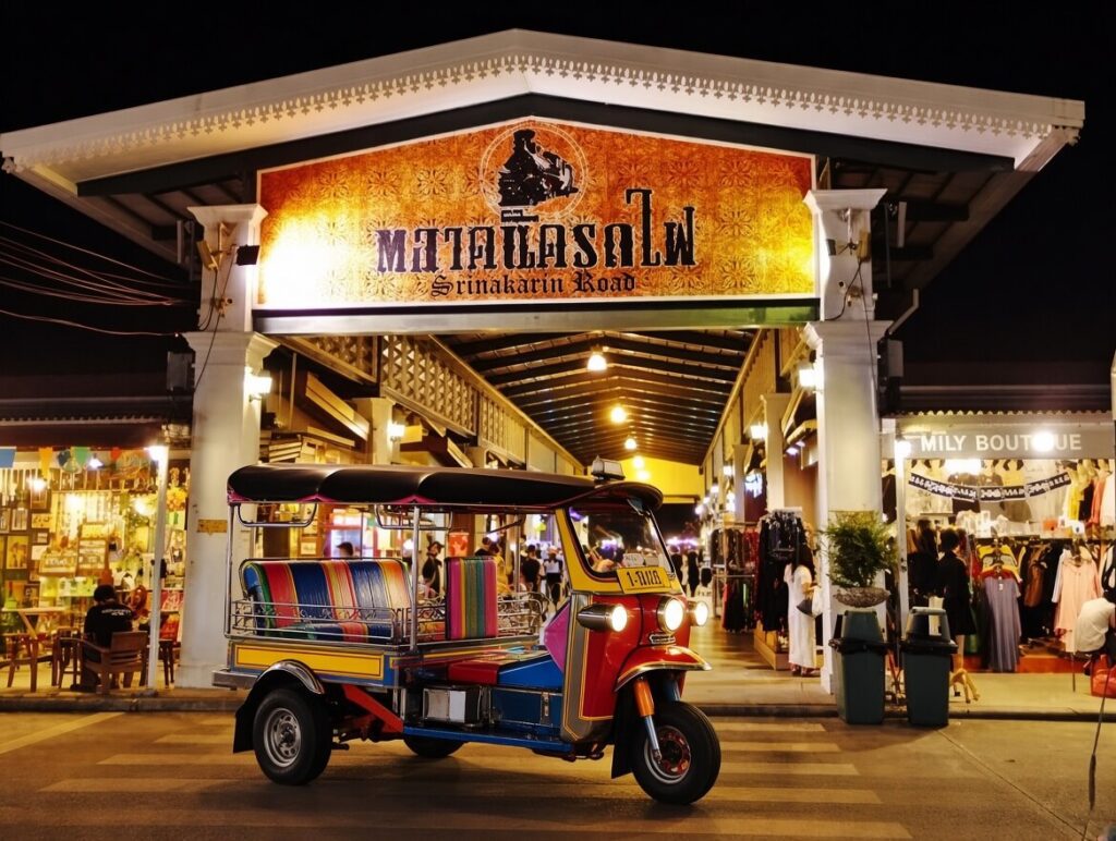 off-path-thailand-bangkok-sri-nakarin-train-market Entrance to Srinakarin Train Market, one of the hidden local markets Bangkok offers for night shopping.