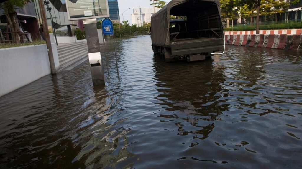 off-path-thailand-bangkok-flood A truck driving through a flooded street in Bangkok during monsoon season
